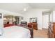 Bright main bedroom featuring a closet and sliding door to the enclosed patio at 2216 Grand Tree Ct, Lake Mary, FL 32746