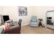 Carpeted office space featuring a chair, desk and adjacent recliner seat at 2216 Grand Tree Ct, Lake Mary, FL 32746