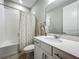 Bright bathroom features a tub with shower, and a neutral palette for a clean, serene atmosphere at 2247 Marsh Sedge Ln, Winter Park, FL 32792