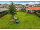 Relaxing common area with chairs under a shade tree, ideal for community gatherings at 2247 Marsh Sedge Ln, Winter Park, FL 32792