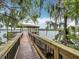 Picturesque dock and covered area providing beautiful views and a peaceful waterfront retreat at 2247 Marsh Sedge Ln, Winter Park, FL 32792
