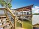 Elevated dock on the lake with covered seating, offering a scenic view and relaxing space at 2247 Marsh Sedge Ln, Winter Park, FL 32792