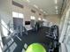 Spacious gym with a variety of equipment and natural light, promoting a healthy lifestyle at 2247 Marsh Sedge Ln, Winter Park, FL 32792