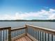 Scenic lake view from the wooden deck, highlighting the peaceful waterfront setting at 2247 Marsh Sedge Ln, Winter Park, FL 32792
