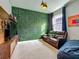 Cozy room with an accent wall, comfortable seating, plush carpet and a modern entertainment center at 2247 Marsh Sedge Ln, Winter Park, FL 32792