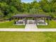 Shaded community picnic area with tables and grills, perfect for outdoor gatherings at 2247 Marsh Sedge Ln, Winter Park, FL 32792