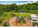 Aerial view of community playground and picnic area surrounded by lush landscaping at 2247 Marsh Sedge Ln, Winter Park, FL 32792