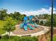 Colorful community playground with slides and climbing structures for children at 2247 Marsh Sedge Ln, Winter Park, FL 32792