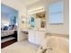 Bright bathroom features a soaking tub, vanity with makeup area, and views into the main bedroom at 2274 Foliage Oak Ter, Oviedo, FL 32766