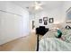 A third view of a spare bedroom with neutral walls and carpet and houses a piano, bed, and closet space at 2274 Foliage Oak Ter, Oviedo, FL 32766