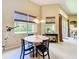 Cozy breakfast nook with views of the backyard, perfect for casual dining and relaxation at 2274 Foliage Oak Ter, Oviedo, FL 32766