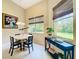 Dining area featuring natural light, complemented by views of the greenery outside the window at 2274 Foliage Oak Ter, Oviedo, FL 32766