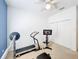 Carpeted room with exercise equipment and ceiling fan, perfect for maintaining an active lifestyle at 2274 Foliage Oak Ter, Oviedo, FL 32766