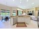 Modern kitchen with stainless steel appliances, ample counter space, and breakfast nook at 2274 Foliage Oak Ter, Oviedo, FL 32766
