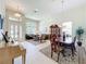 Large living room with ample natural light and a seamless flow into the dining area at 2274 Foliage Oak Ter, Oviedo, FL 32766