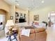 Spacious living room with large built-ins, neutral walls, and tiled floors for easy cleaning at 2274 Foliage Oak Ter, Oviedo, FL 32766
