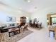 Spacious living room with a dining area, tile floors, and plenty of natural light at 2274 Foliage Oak Ter, Oviedo, FL 32766
