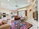 Open-concept living room with ceiling fan and view of the backyard and kitchen at 2274 Foliage Oak Ter, Oviedo, FL 32766