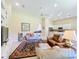 Bright living room featuring neutral walls, comfortable seating, and a ceiling fan at 2274 Foliage Oak Ter, Oviedo, FL 32766