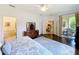 Spacious main bedroom with hardwood floors, and access to outdoor patio at 2274 Foliage Oak Ter, Oviedo, FL 32766