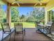 Covered patio features outdoor seating with views of the lush backyard and garden at 2274 Foliage Oak Ter, Oviedo, FL 32766