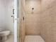 Tiled walk-in shower featuring glass doors, and a hand-held shower head at 2274 Foliage Oak Ter, Oviedo, FL 32766