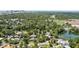 Panoramic aerial shot showcasing the neighborhood's canopy of trees, water features, and city skyline at 2312 S Summerlin Ave, Orlando, FL 32806