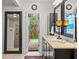 Elegant bathroom featuring a double vanity, walk-in shower and stylish fixtures and view of outdoor garden at 2312 S Summerlin Ave, Orlando, FL 32806