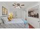 Comfortable bedroom with ceiling fan, closet with mirrored doors, and view of art at 2312 S Summerlin Ave, Orlando, FL 32806