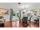 Elegant dining area with a stylish table, hardwood floors, and natural light, perfect for entertaining at 2312 S Summerlin Ave, Orlando, FL 32806