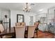 View of the dining area featuring a decorative mirror, hardwood floors, and chandelier lighting at 2312 S Summerlin Ave, Orlando, FL 32806