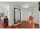 Open foyer with gleaming hardwood floors and ample natural light, creating a welcoming entrance at 2312 S Summerlin Ave, Orlando, FL 32806