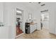 Bright laundry room with wood flooring, sink, and laundry machines, conveniently located near the kitchen at 2312 S Summerlin Ave, Orlando, FL 32806