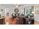 Inviting living room featuring hardwood floors, a ceiling fan, and a leather sofa at 2312 S Summerlin Ave, Orlando, FL 32806