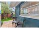 Charming patio area with outdoor seating, perfect for relaxing and enjoying the serene surroundings at 2312 S Summerlin Ave, Orlando, FL 32806
