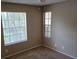 Bedroom with two windows and carpet flooring at 236 Afton Sq # 207, Altamonte Springs, FL 32714