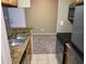Kitchen with stainless steel appliances, granite counters, and wood cabinets with an open design at 236 Afton Sq # 207, Altamonte Springs, FL 32714