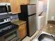 Functional kitchen with granite counters, modern appliances and an in-unit washer/dryer at 236 Afton Sq # 207, Altamonte Springs, FL 32714