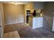Inviting living area featuring neutral paint, plush carpeting, and an open layout to the kitchen at 236 Afton Sq # 207, Altamonte Springs, FL 32714