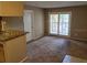 Open living room and kitchen area with sliding glass door access to a private balcony at 236 Afton Sq # 207, Altamonte Springs, FL 32714