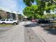 A well-maintained parking lot located near a multi-story residential building surrounded by lush trees and landscaping at 236 Afton Sq # 207, Altamonte Springs, FL 32714