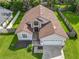 Aerial view of a single-Gathering home with a well-maintained lawn and a two-car garage at 2489 Tommys Turn, Oviedo, FL 32766