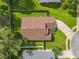 Overhead shot of a home with a well-kept lawn and a driveway, showcasing the property's layout and curb appeal at 2489 Tommys Turn, Oviedo, FL 32766
