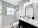 Bright bathroom with a glass-enclosed shower and stylish vanity at 2489 Tommys Turn, Oviedo, FL 32766