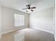 Neutral bedroom with a window and tile flooring at 2489 Tommys Turn, Oviedo, FL 32766