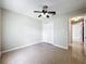 Cozy bedroom featuring neutral paint and tile flooring at 2489 Tommys Turn, Oviedo, FL 32766