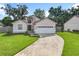 Single-Gathering home boasting a well-manicured lawn and a two-car garage at 2489 Tommys Turn, Oviedo, FL 32766