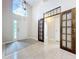 View of the foyer with high ceilings, tile floors and large windows at 2489 Tommys Turn, Oviedo, FL 32766