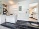This laundry room has a washer and dryer, as well as shelving for storage and access to the kitchen at 2489 Tommys Turn, Oviedo, FL 32766