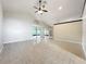 Spacious living room with tile floors, and sliding glass door at 2489 Tommys Turn, Oviedo, FL 32766